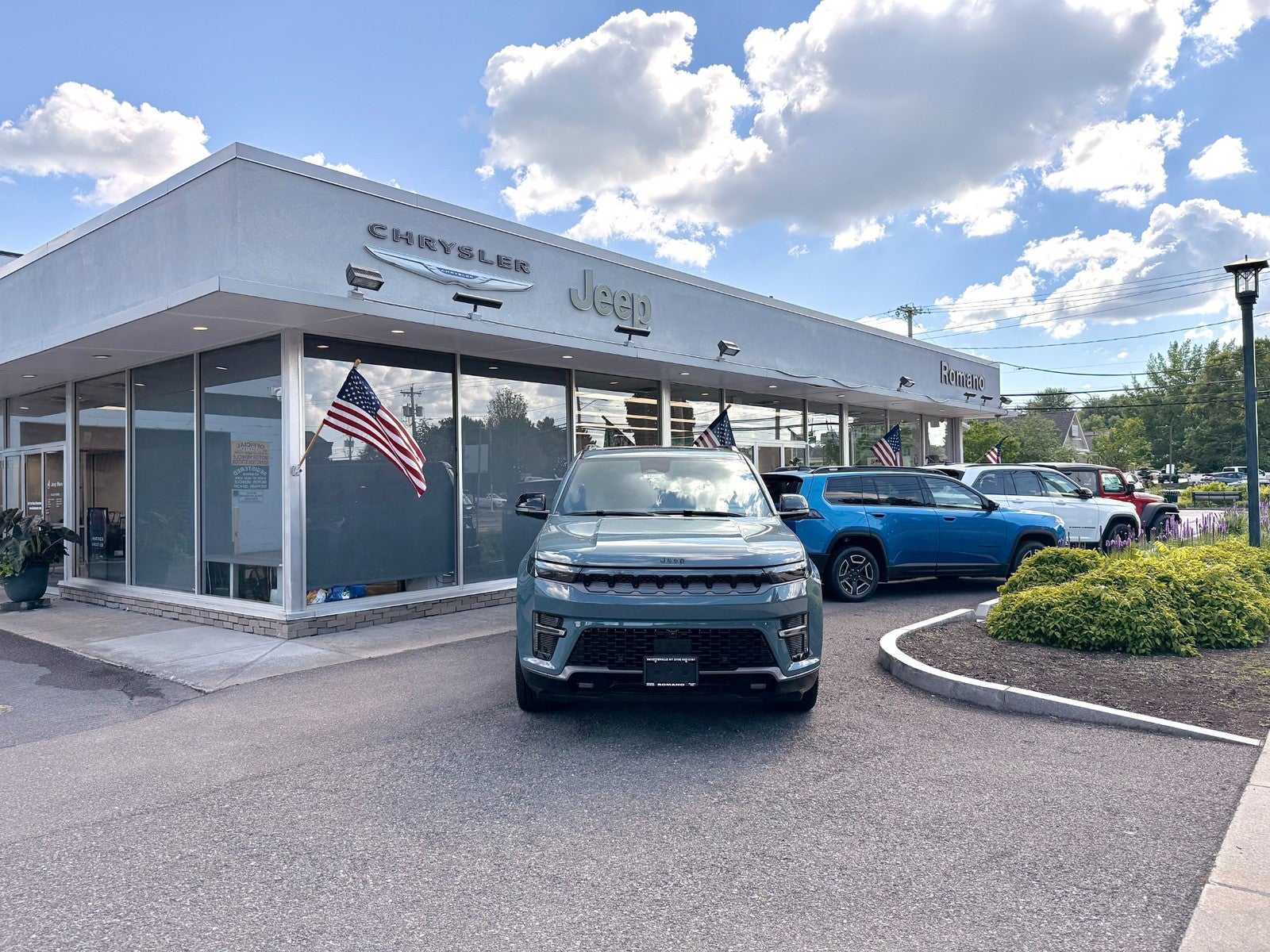 Certified technician servicing a vehicle at Romano Chrysler Jeep